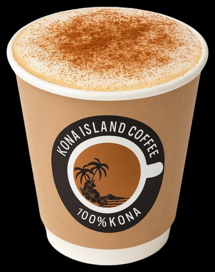 A hot Captain Cook latte in a paper cup, dusted with cinnamon.