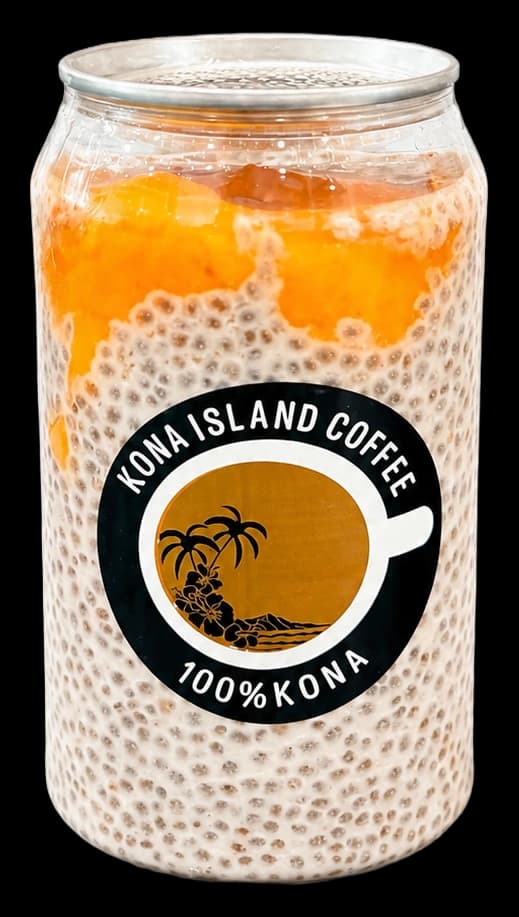 A jar of Mango Haupia Chia Pudding, mango spread over coconut chia pudding, Kona Island Coffee label on the jar.